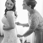 St. Petersburg Wedding, Bride and Mom Putting on Wedding Gown