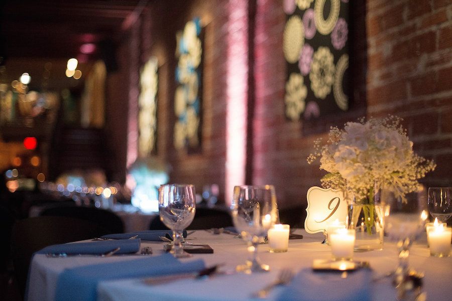 Reception Decor with Dusty Blue Accents and White Centerpieces at downtown St. Pete Wedding Venue NOVA 535| Photo by Tampa Bay Wedding Photographer Kristen Marie Photography