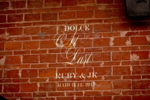 Elegant Black and White St Pete Wedding Custom Projection on Exposed Brick Wall | Unique Downtown St Pete Venue NOVA 535