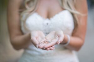 St. Pete bride holding wedding rings