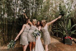 Bridesmaids in metallic lace dresses