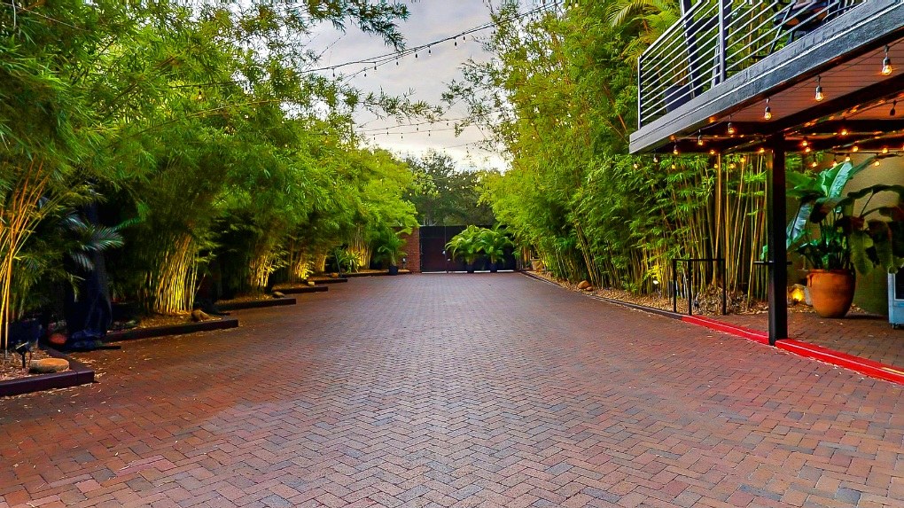 private, Lush brick and bamboo courtyard at downtown St. Pete, Florida historic wedding venue and unique events space NOVA 535 - facing west