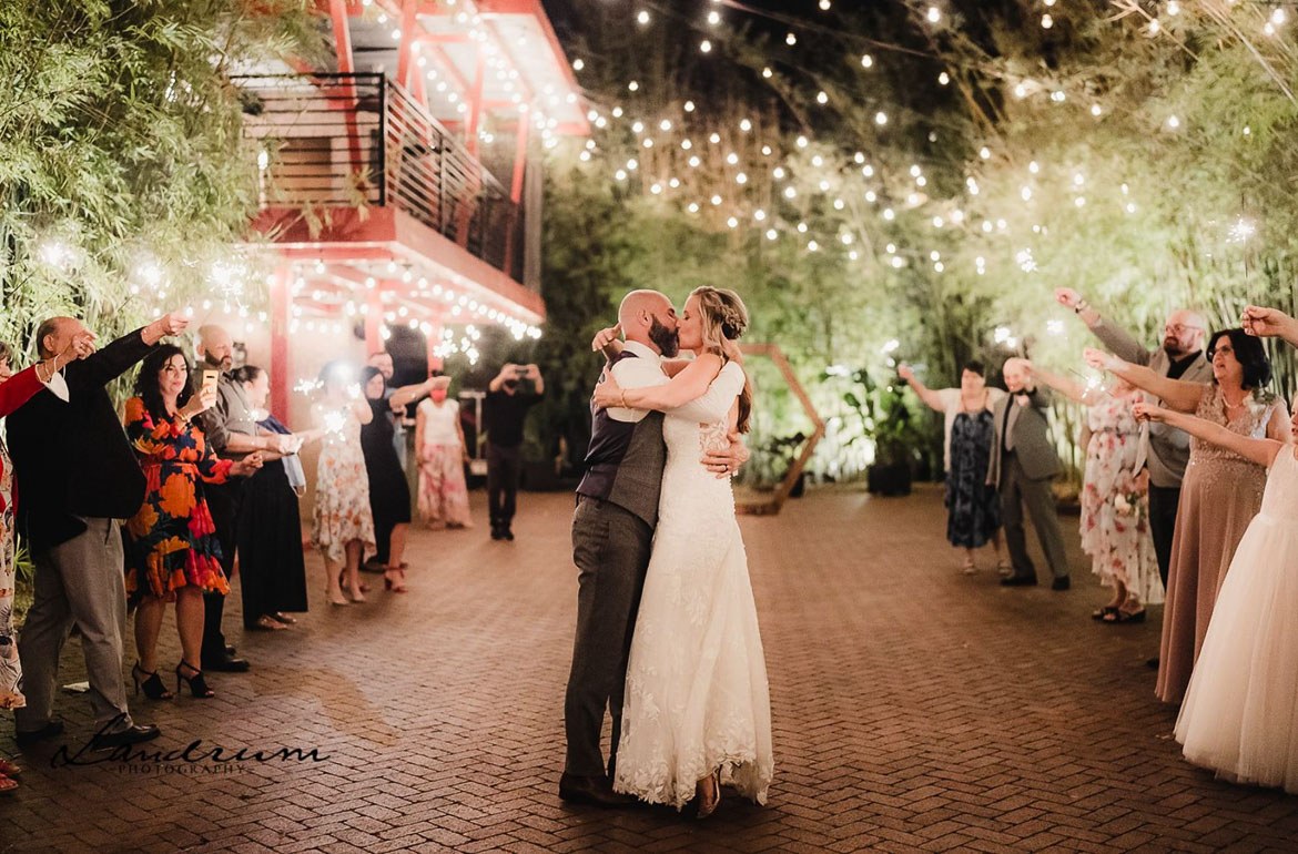 2021 Katie and Zeke kissing during sparkler exit at NOVA 535 Wedding, Landrum Photography image