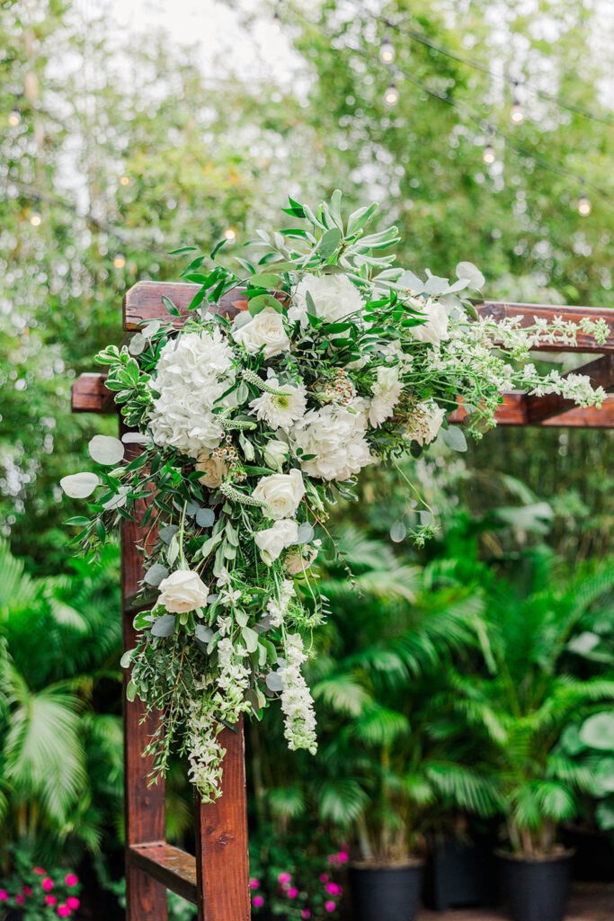 Elegant White Flowers and Greenery Wedding Ceremony Arch Arrangement