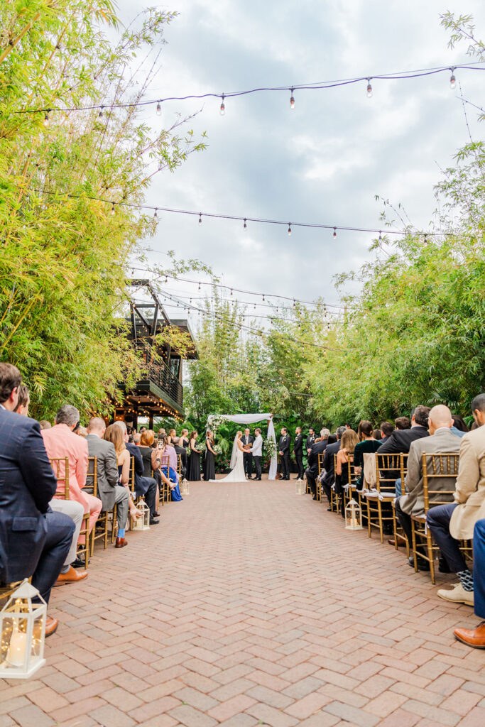 Elegant White and Greenery Wedding Ceremony in Bamboo Courtyard | Tampa Bay Event Venue Nova 535