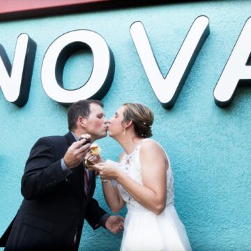 Newlyweds enjoy cupcake at NOVA 535 during their vintage St. Petersburg wedding