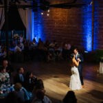Industrial Brick Wall Ballroom First Dance Wedding Photo with Blue Uplighting | Unique DTSP Wedding Venue NOVA 535