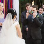 Vietnamese wedding ceremony with colorful streamer backdrop