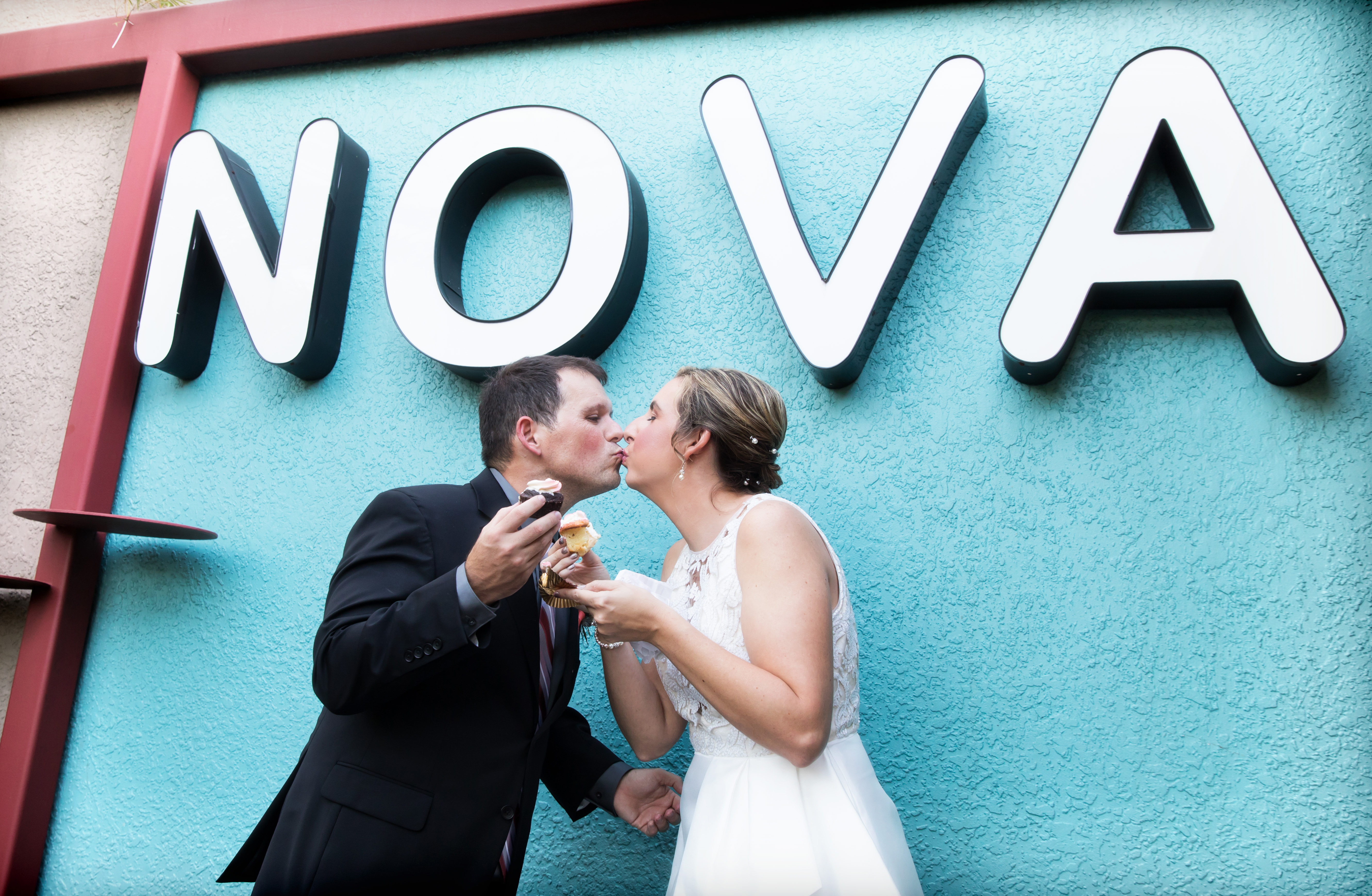 Newlyweds enjoy cupcake at NOVA 535 during their vintage St. Petersburg wedding